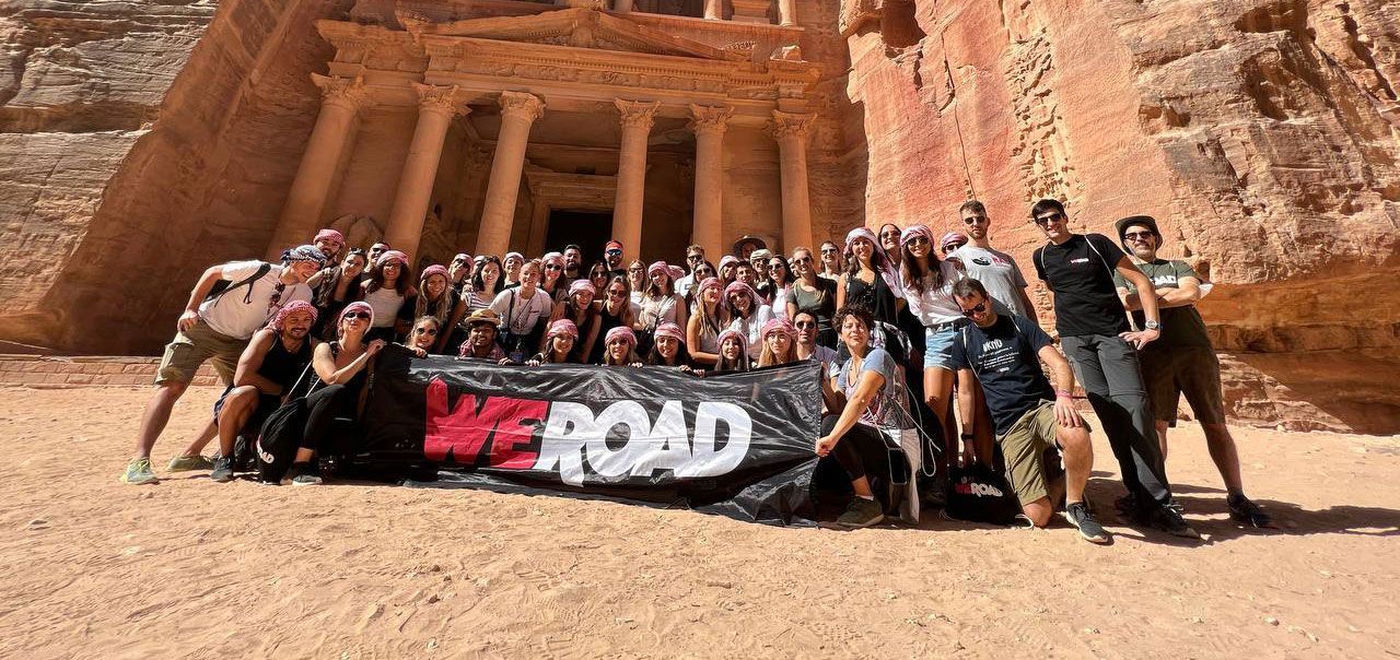 WeRoad team members in front of the Treasure of Petra in Jordan