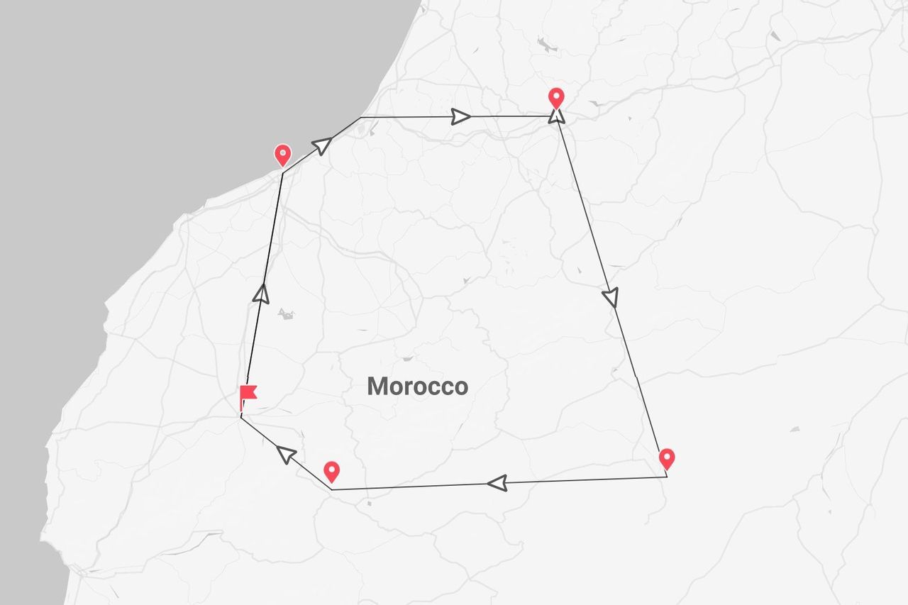 Un mapa de Marruecos mostrando un itinerario de viaje multiparada, indicado por una línea y chinchetas de ubicación rojas.