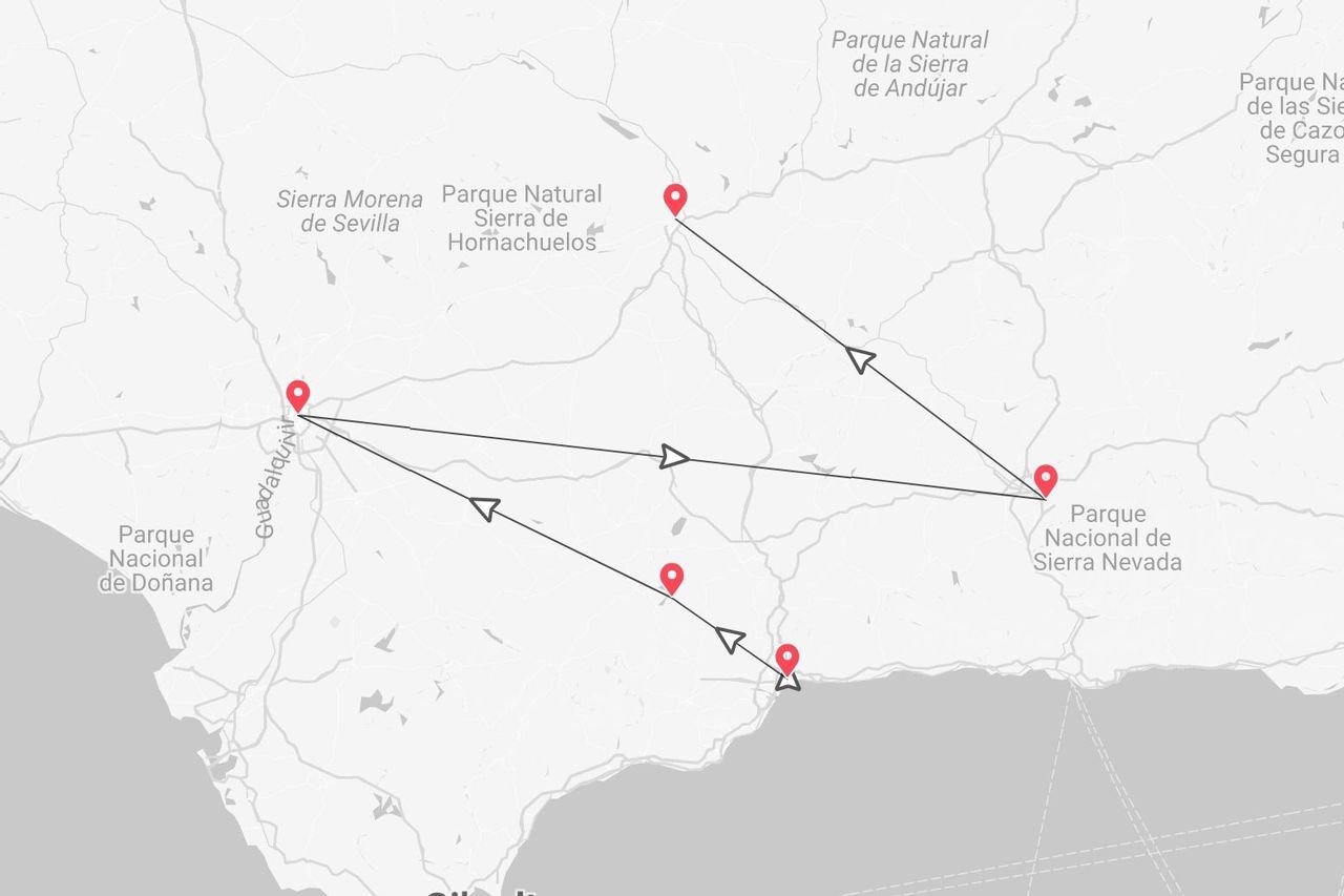 A map of a travel route in Andalusia, Spain, showing pins near Sierra Morena, Sierra Nevada, and the Guadalquivir river.