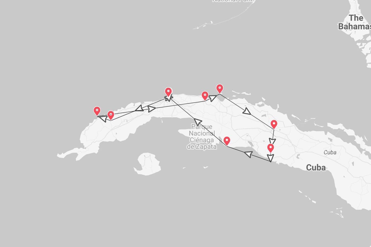 A map of Cuba showing a travel itinerary marked with red pins and a black directional line.