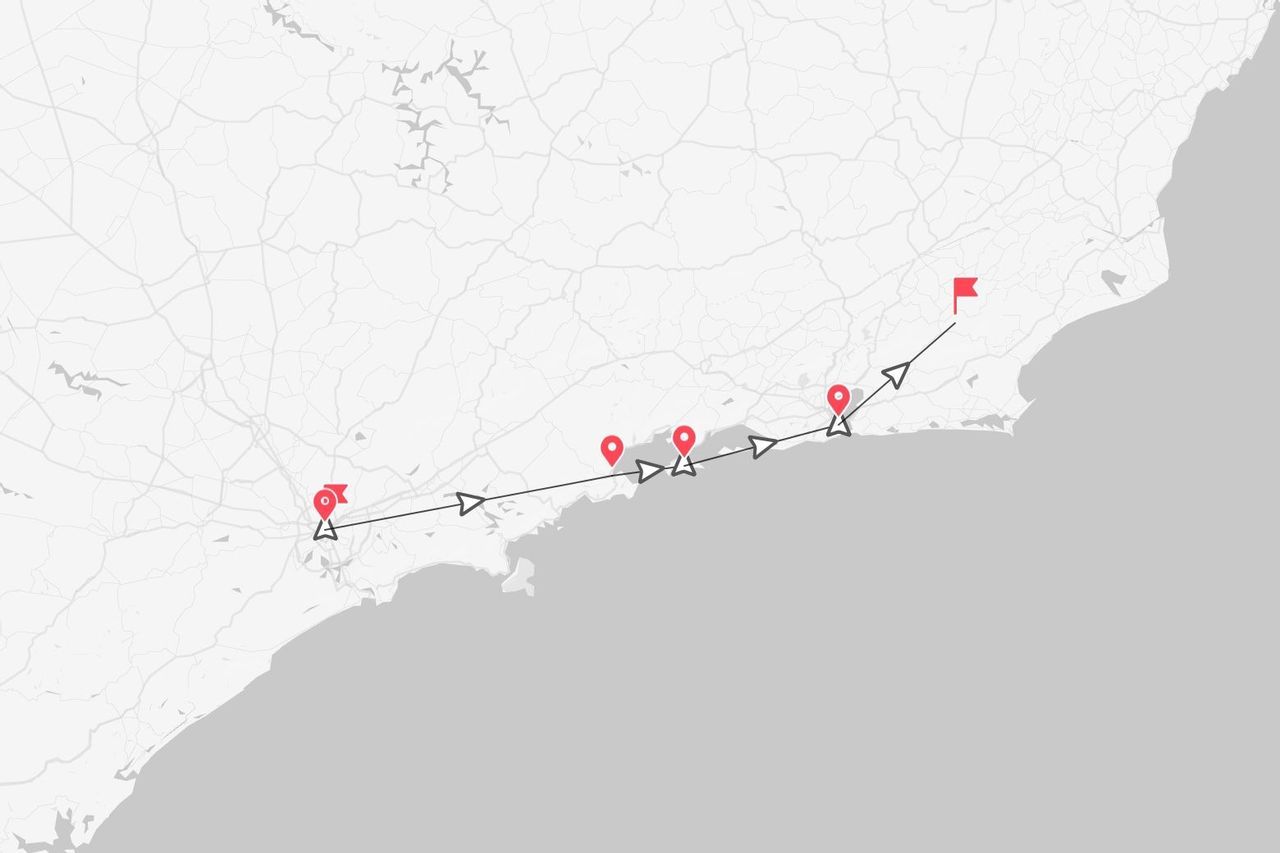 A minimalist map illustrating a travel route along a coastline, marked by a black line and red location pins.