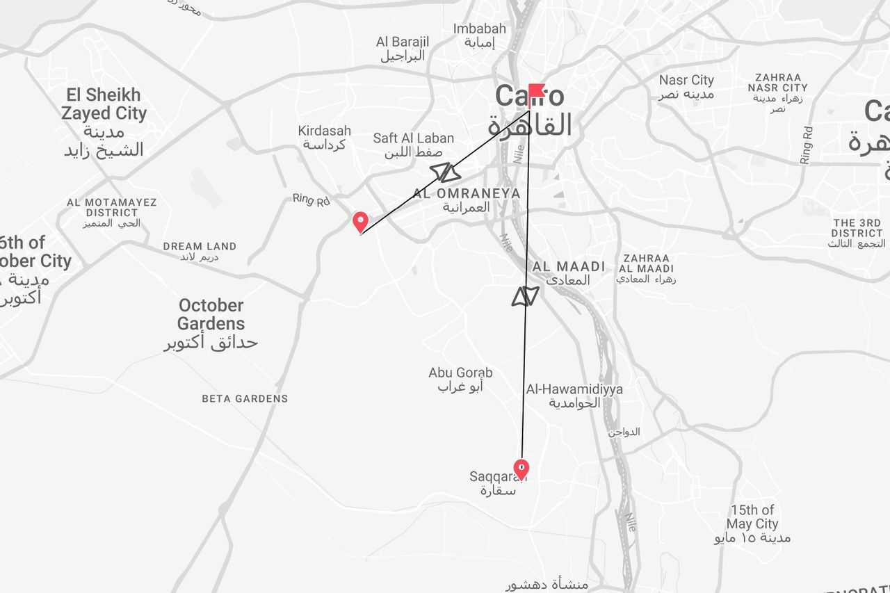 A grayscale map of Cairo, Egypt, showing a travel route with markers at Al Omraneya, Al Maadi, and Saqqara.