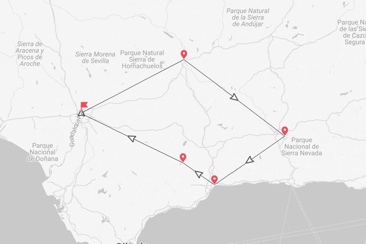 Una mappa che mostra un itinerario attraverso l'Andalusia, Spagna, che collega diversi parchi naturali tra cui Sierra Morena e Sierra Nevada.
