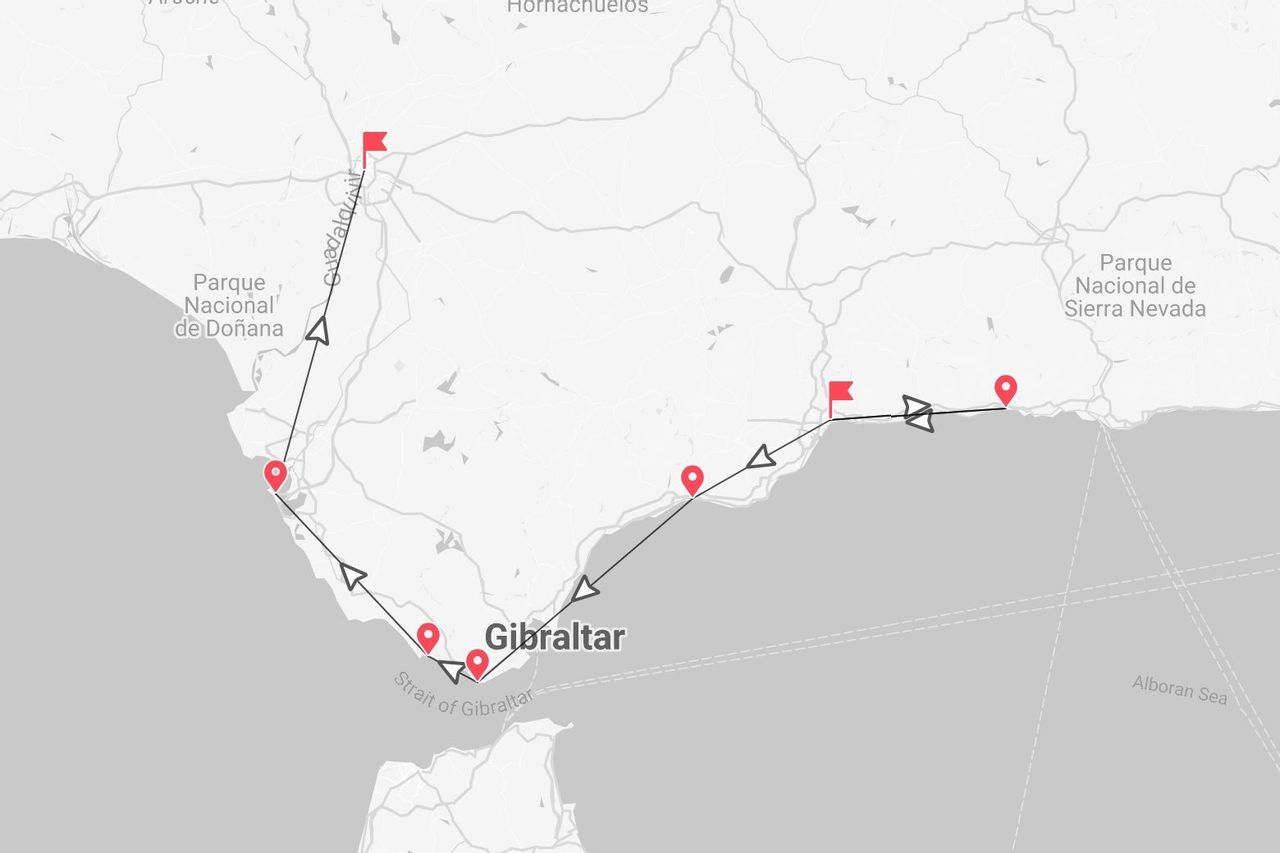 Una mappa che mostra un itinerario di viaggio lungo la costa meridionale della Spagna, passando per Gibilterra e in prossimità dei parchi nazionali di Doñana e Sierra Nevada.