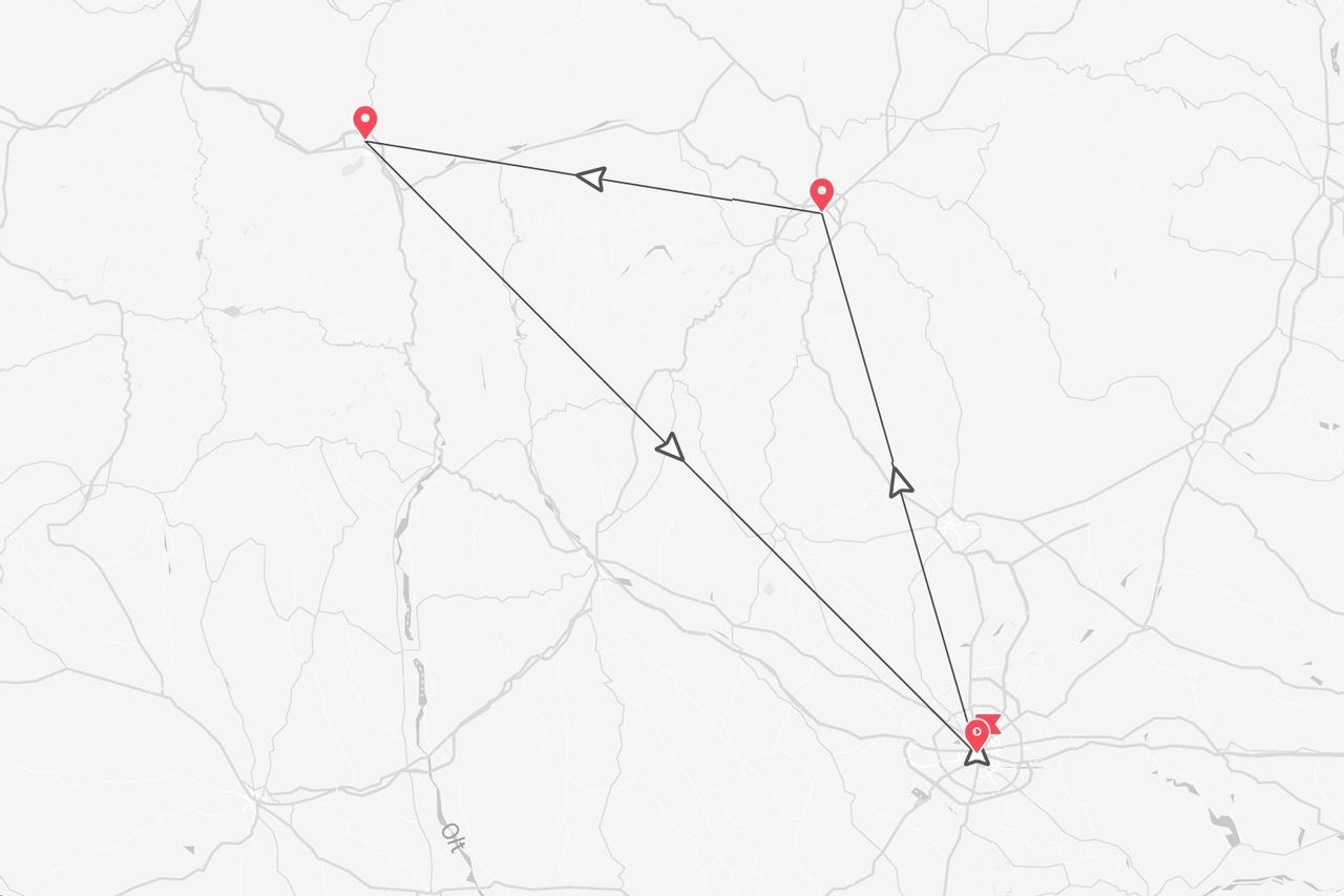 Un mapa gris estilizado que muestra una ruta de viaje conectando cuatro pines rojos con líneas y flechas negras, formando un circuito.