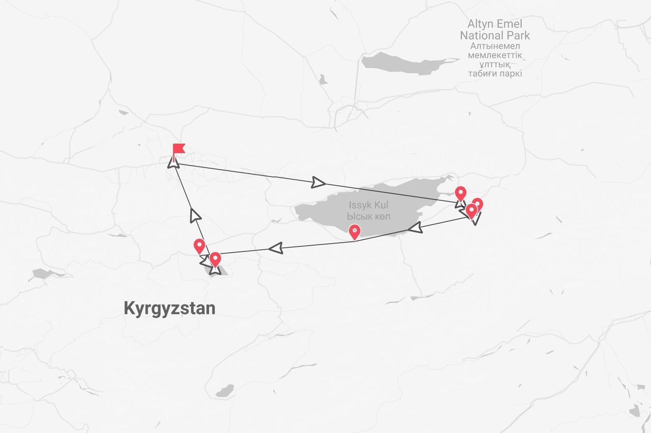 Une carte montrant un itinéraire de voyage au Kirghizistan, faisant le tour du lac Issyk-Kul et passant près du parc national d'Altyn Emel.