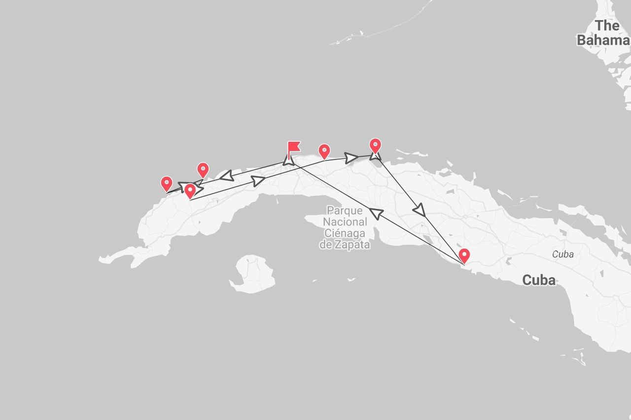 Una mappa di Cuba con un percorso di viaggio segnato da puntine rosse e una linea nera, che indica un itinerario attraverso l'isola.