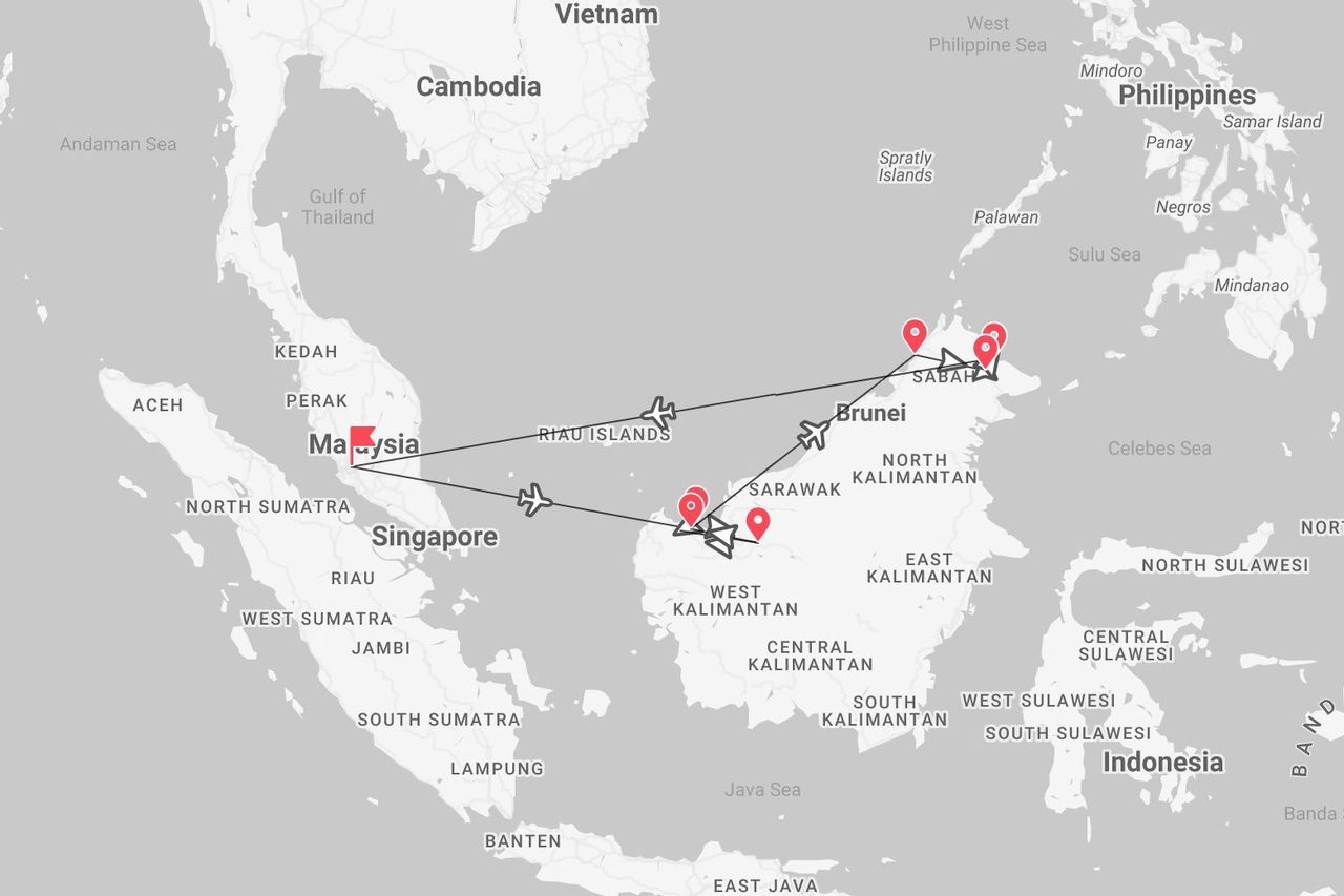 Une carte de l'Asie du Sud-Est montrant un itinéraire de vol entre la Malaisie et les régions de Sarawak et Sabah sur l'île de Bornéo.