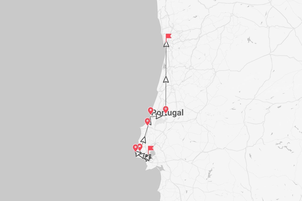 Une carte du Portugal montrant un itinéraire de voyage le long de la côte marqué de punaises et de drapeaux rouges.