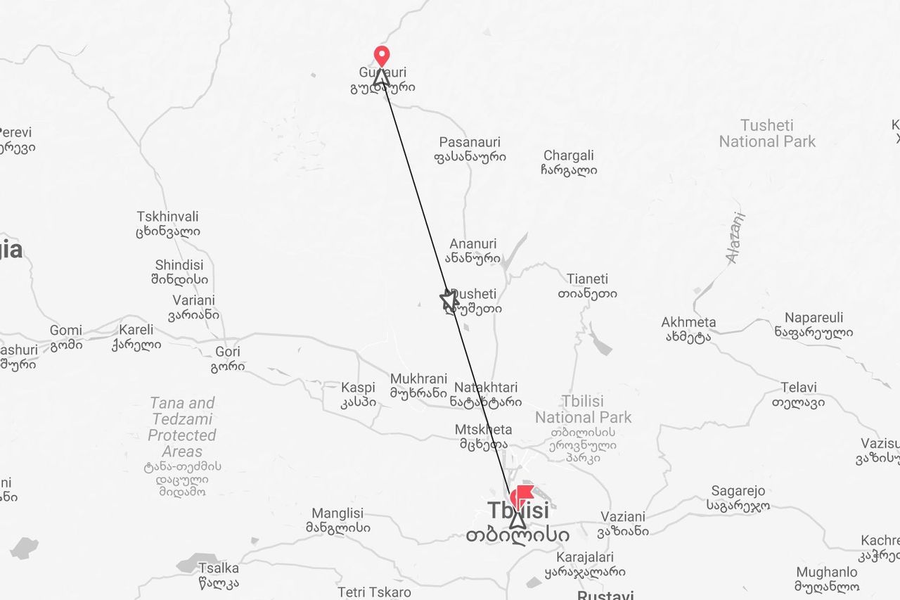 A map of Georgia showing a travel route marked with a black line starting from the capital city, Tbilisi, and ending in Gudauri.