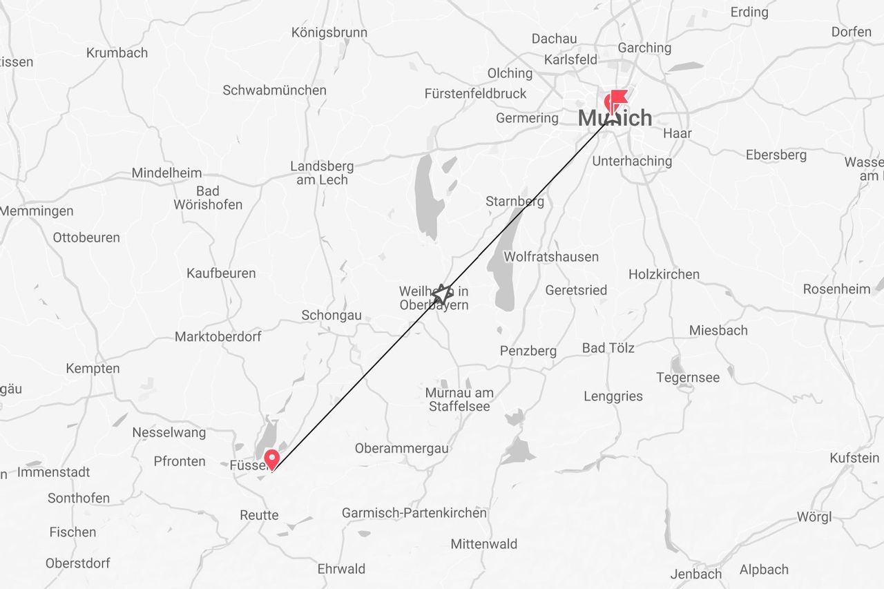 A grayscale map showing a travel route marked with a line from Munich to Füssen in Germany.