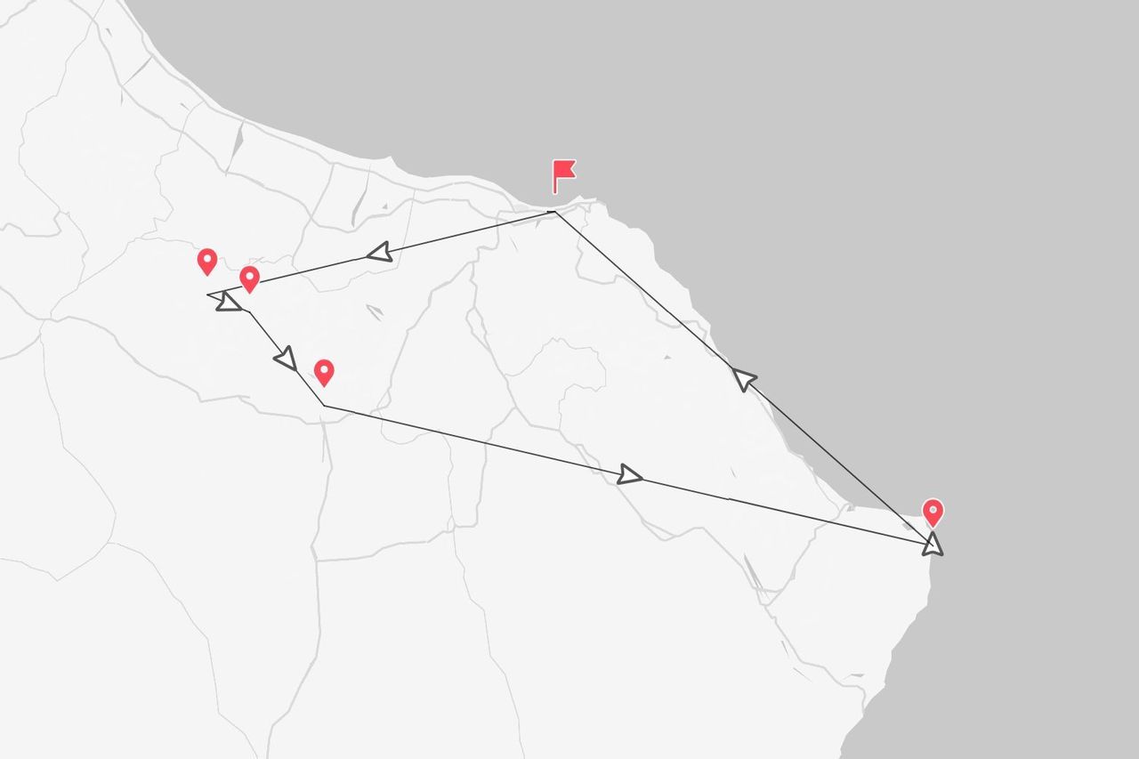 Una mappa stilizzata che mostra un itinerario di viaggio lungo una costa, contrassegnata da puntine rosse e una bandierina di destinazione finale.