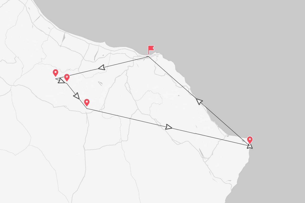 Une carte minimaliste montrant un itinéraire de voyage le long d'une côte avec des épingles de localisation rouges et des flèches directionnelles.