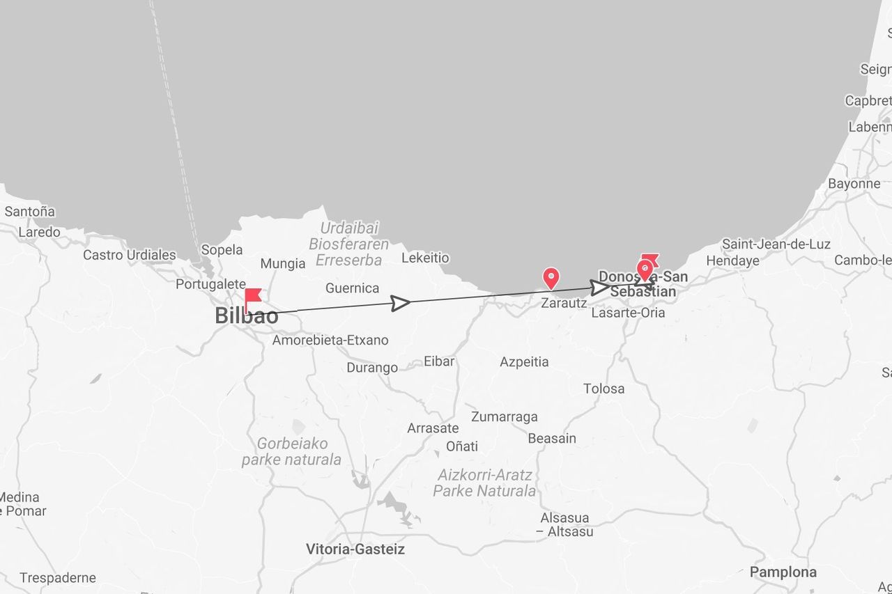 A map showing a travel route from Bilbao to Donostia-San Sebastián along the northern coast of Spain, with waypoints marked in red.