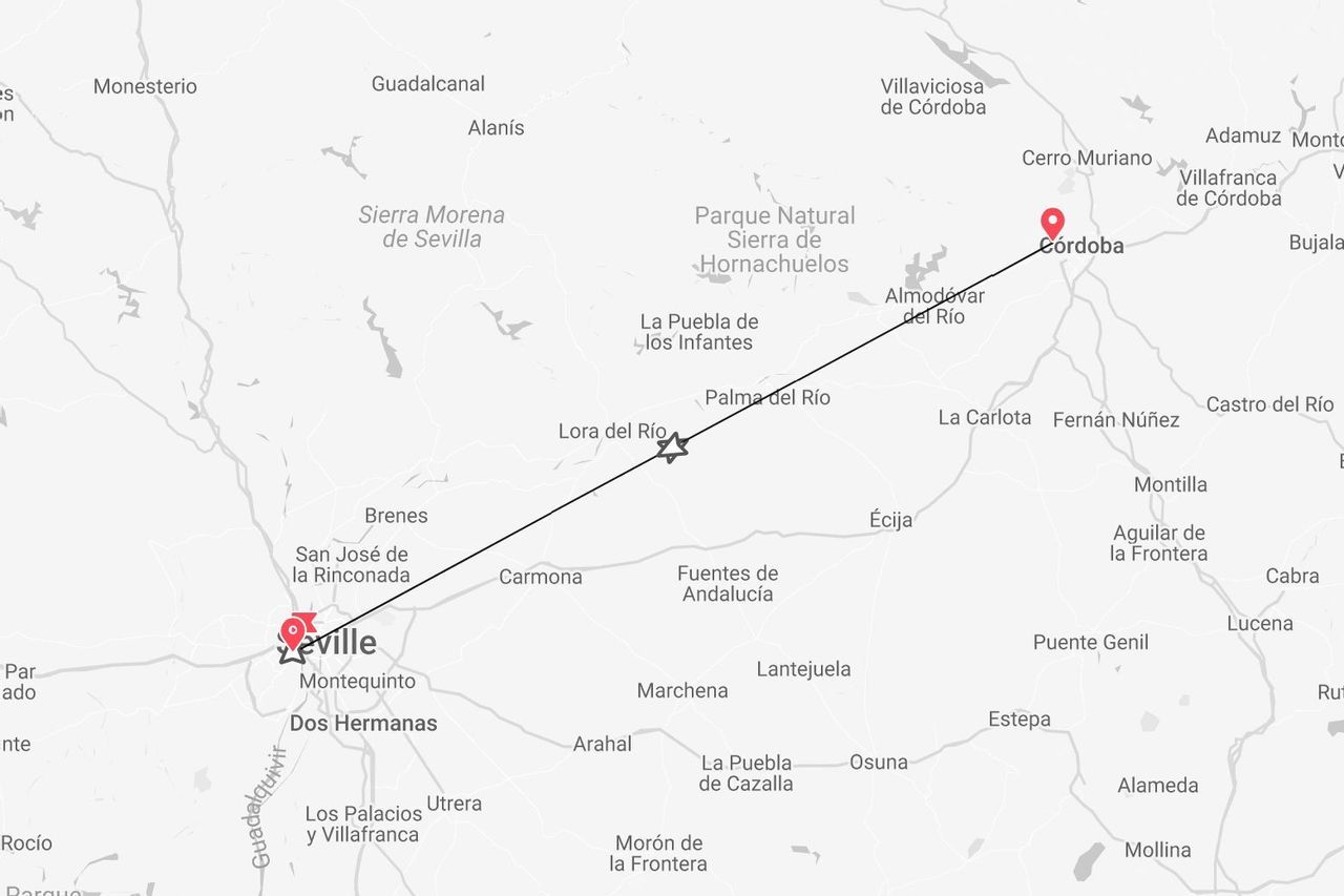 A map showing a travel route marked with a line from Seville to Córdoba in Spain.