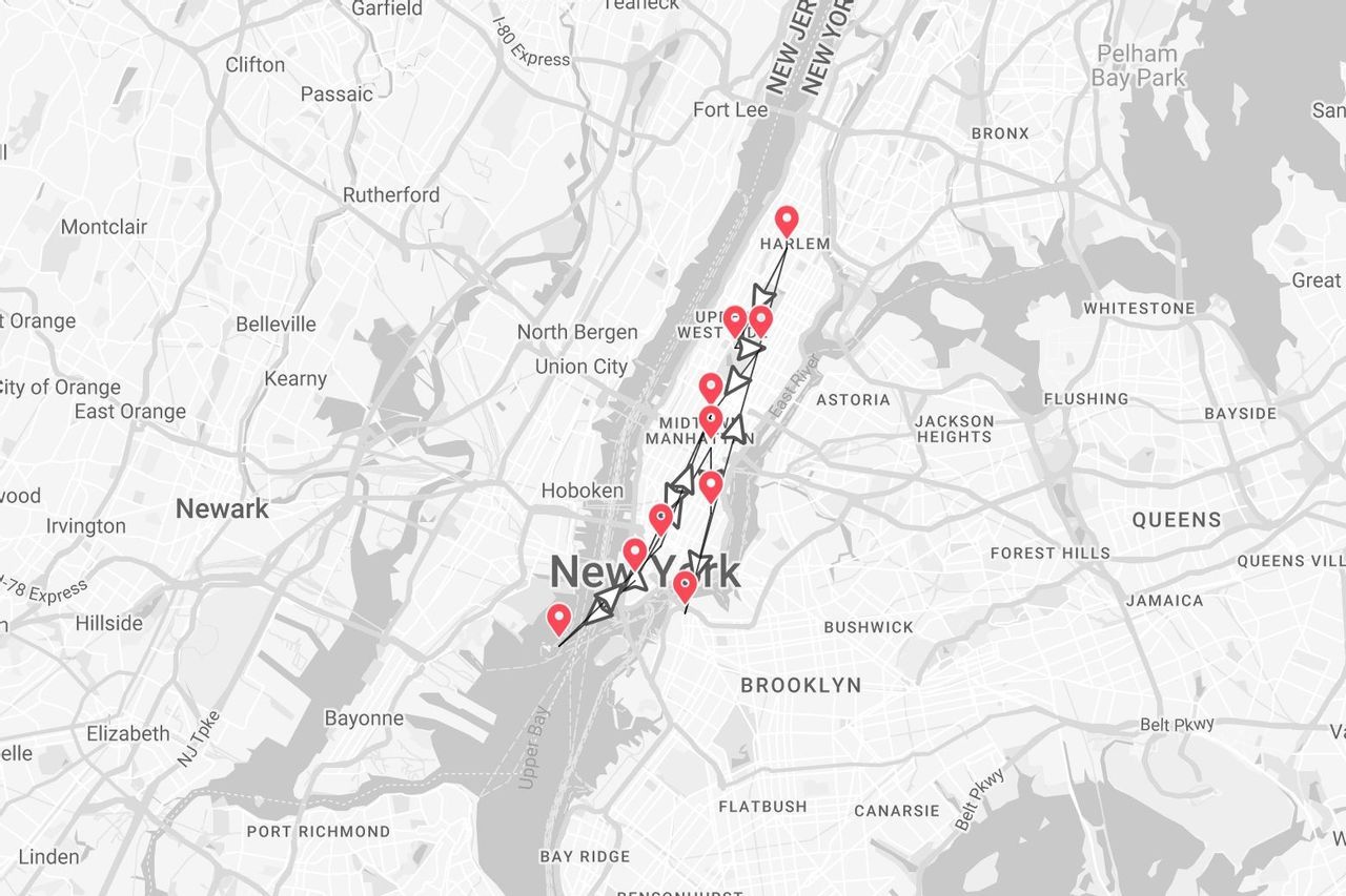 A grayscale map of New York City showing a travel itinerary with red pins tracing a path through Manhattan, from downtown to Harlem.