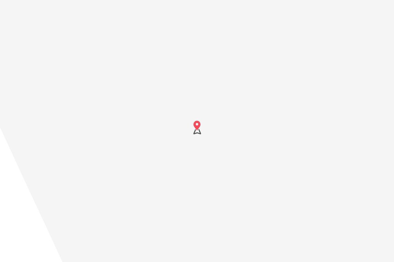 Un'icona minimalista a forma di puntina rossa è centrata su uno sfondo grigio chiaro.
