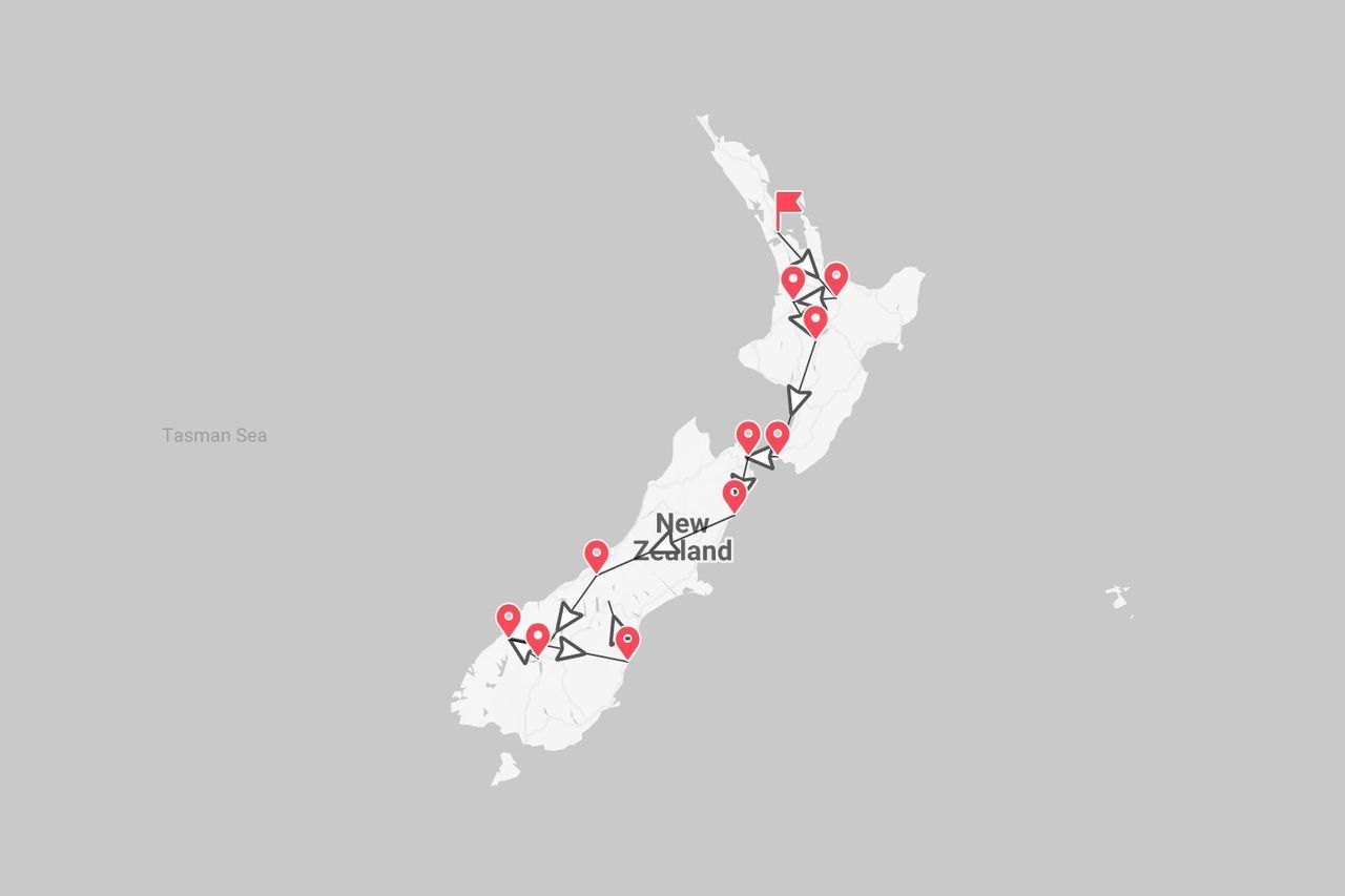 Mappa della Nuova Zelanda con itinerario di viaggio tra l'Isola del Nord e l'Isola del Sud, segnalato con puntine rosse.