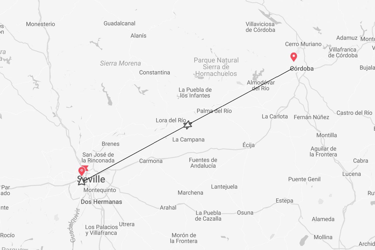 A map of southern Spain showing a highlighted travel route between the cities of Seville and Córdoba.