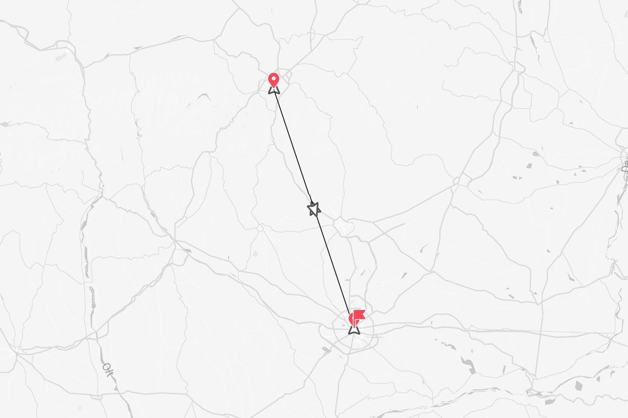 Una mappa stilizzata che mostra un percorso tra due punti contrassegnati da icone rosse, collegati da una linea retta con un'icona a stella al centro.