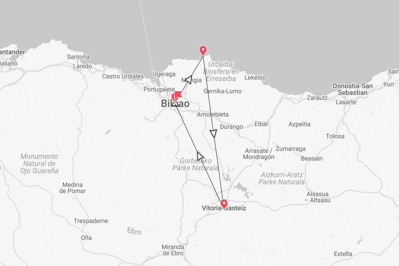 Una mappa che mostra un itinerario di viaggio attraverso i Paesi Baschi, collegando Bilbao, la Riserva della Biosfera di Urdaibai e Vitoria-Gasteiz.