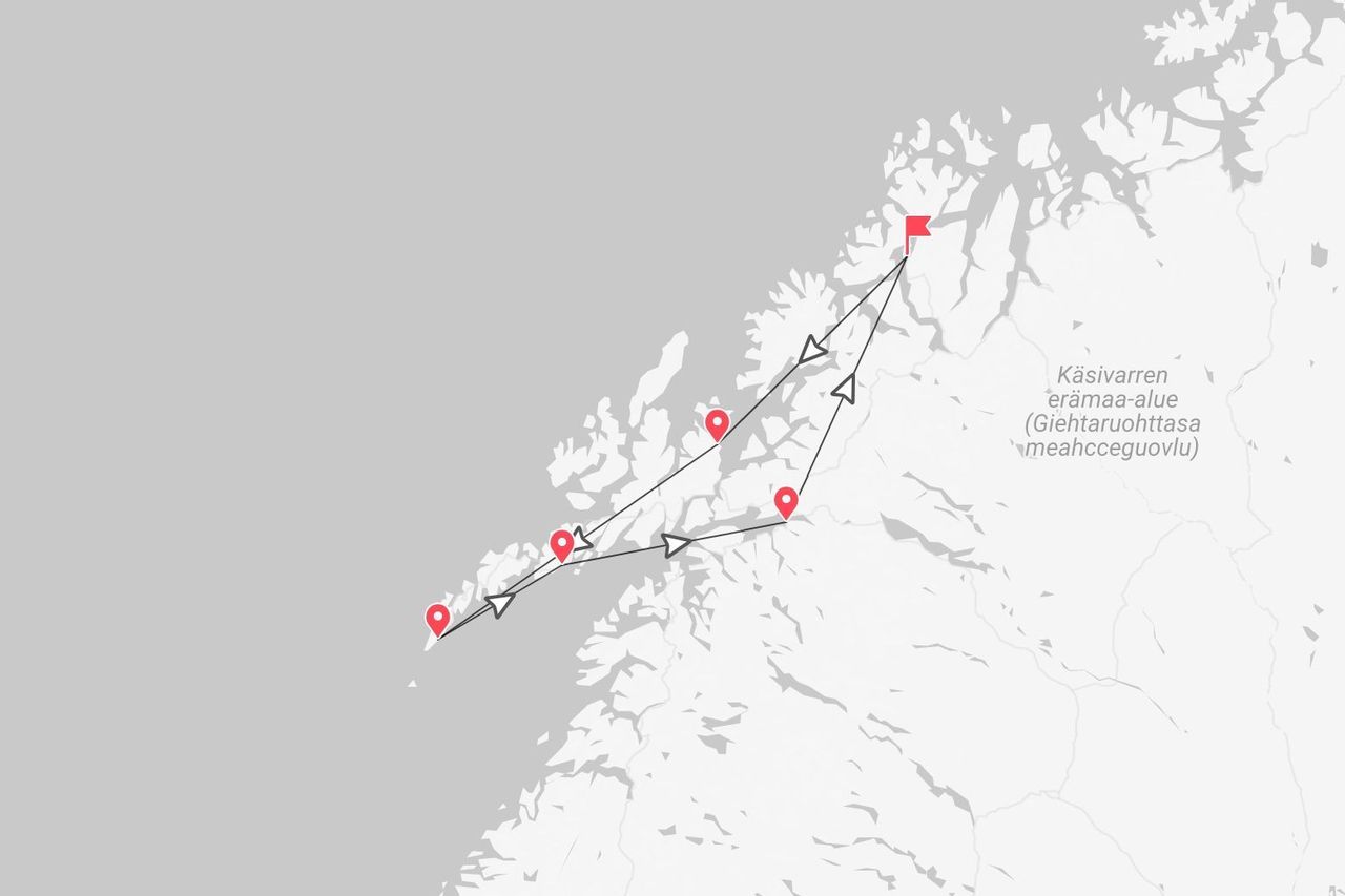 Mappa di un itinerario lungo la costa, con percorso segnato da puntine e frecce rosse, etichettato Käsivarren erämaa-alue.