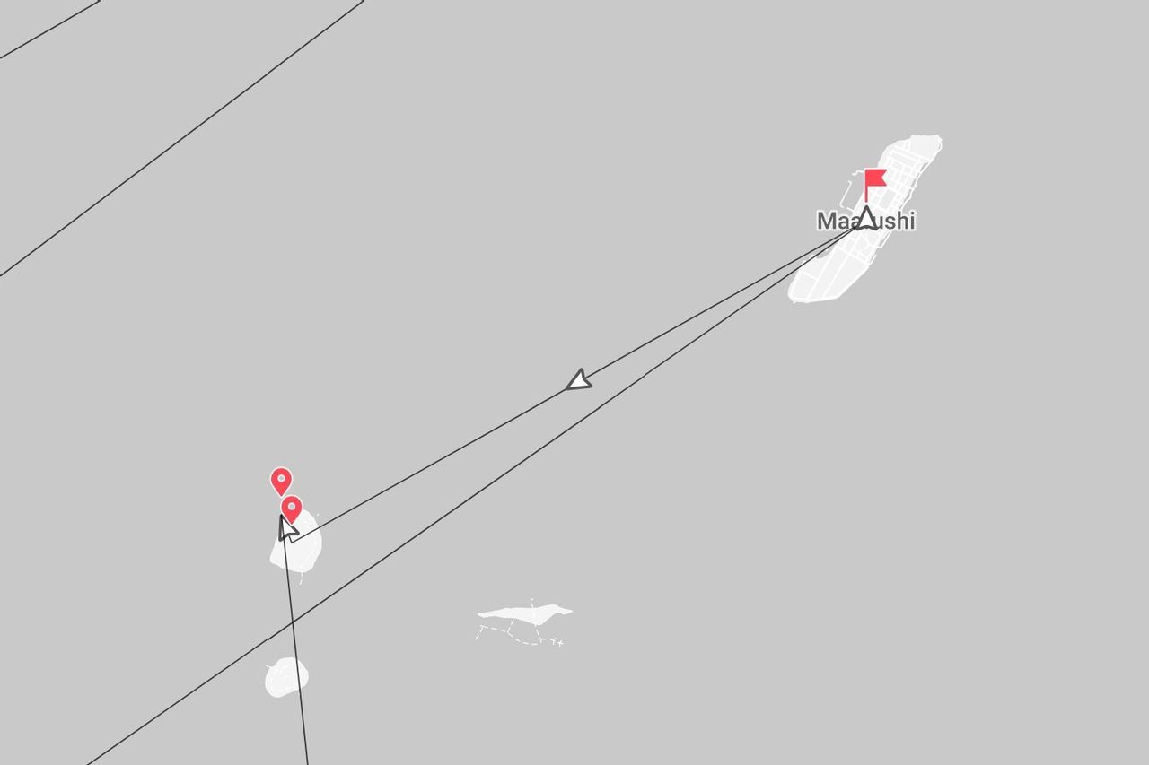 A digital map showing a travel route between several small islands, with the island of Maafushi marked with a red flag pin.