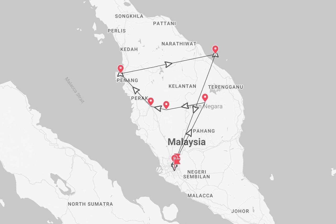 Una mappa che mostra un itinerario di viaggio attraverso la Malesia peninsulare, con tappe segnate a Penang, Perak e Taman Negara.