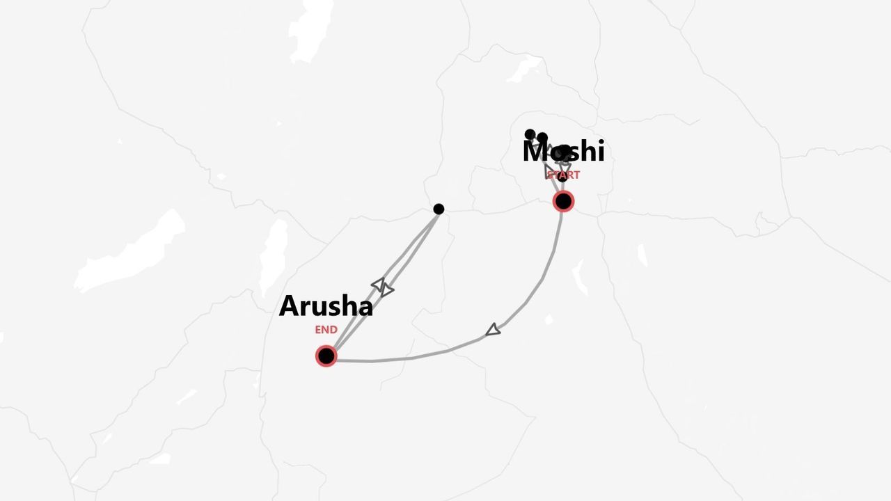 Une carte minimaliste montrant un itinéraire de voyage qui commence à Moshi et se termine à Arusha, avec le tracé marqué par une ligne grise.