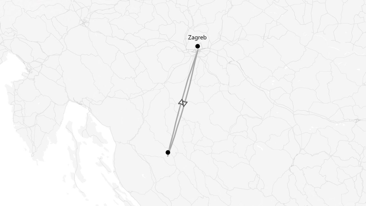 Eine Graustufenkarte, die eine Reiseroute mit einem Flugsymbol zwischen Zagreb und einem weiteren Reiseziel zeigt.