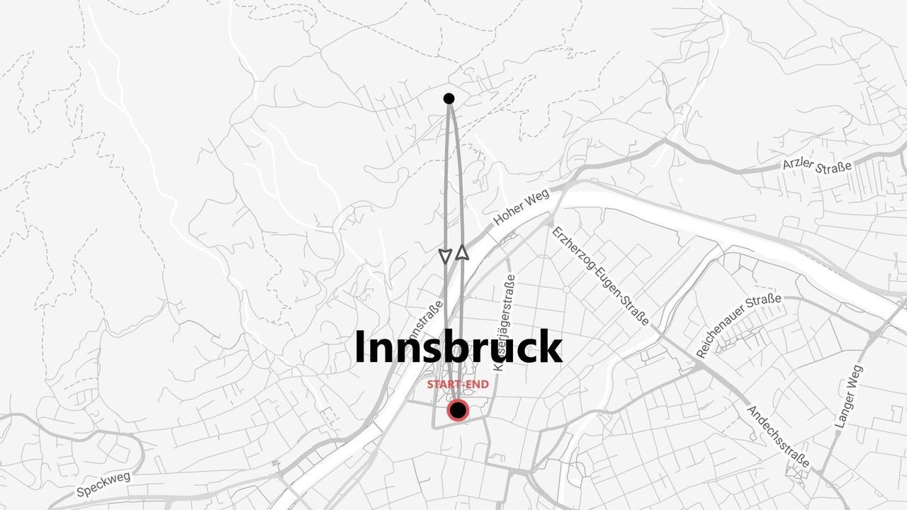 Une carte en noir et blanc illustrant un itinéraire à travers la ville d'Innsbruck, avec un point de départ et un point d'arrivée marqués.