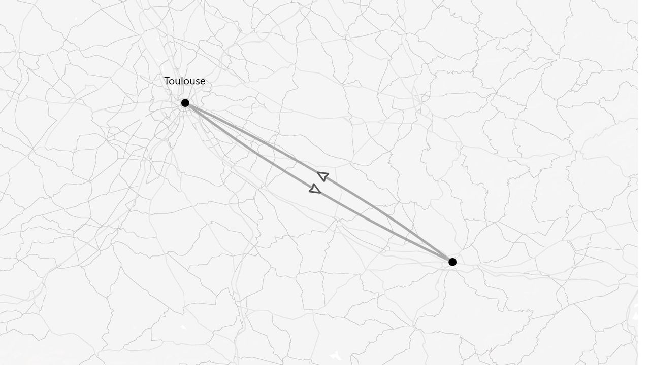 Une carte en niveaux de gris montrant un itinéraire aller-retour entre Toulouse et une destination non identifiée, via un réseau routier.