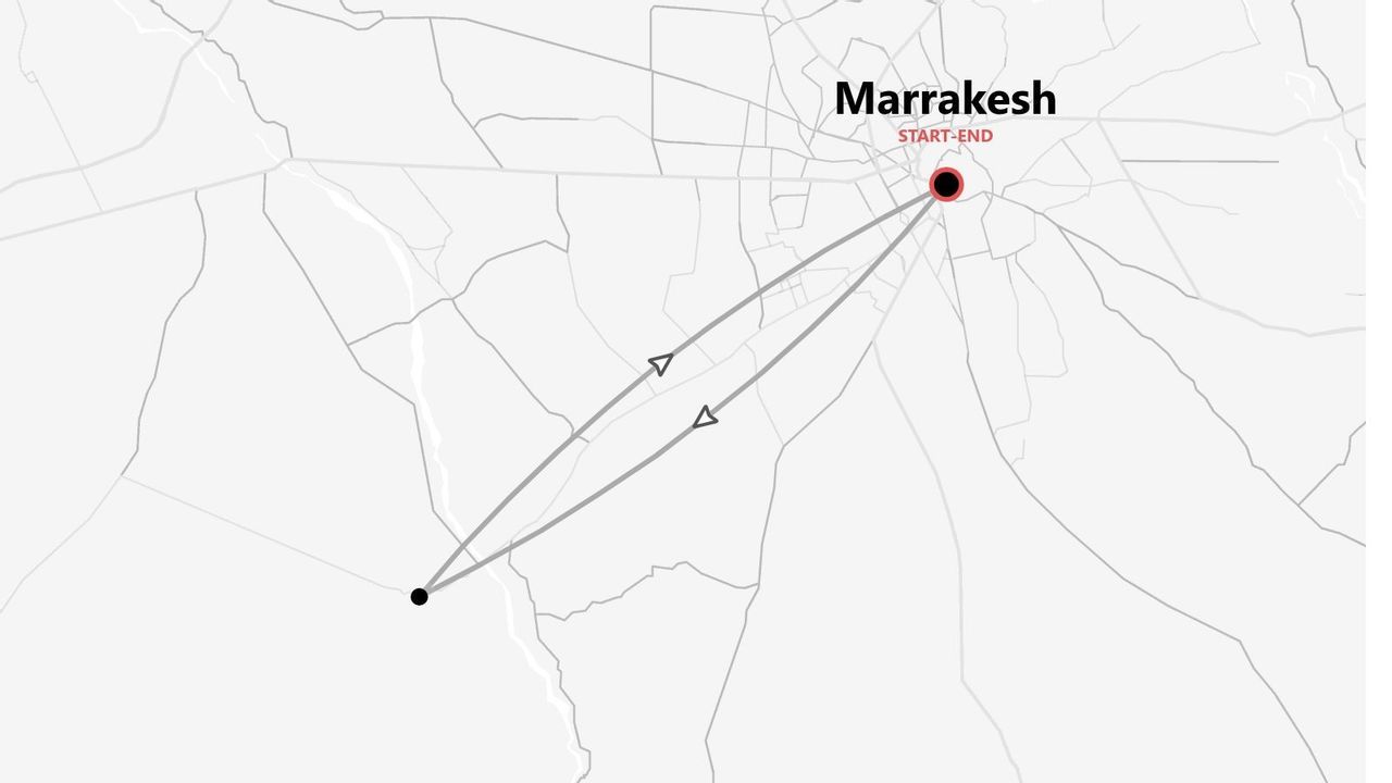 A grayscale map showing a travel route that forms a loop, starting and ending at a red marker in Marrakesh.