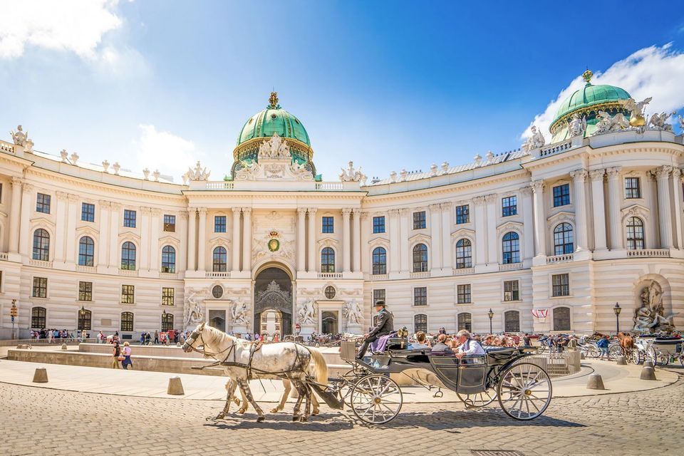A horse-drawn carriage in front of the Hofburg palace in Vienna.