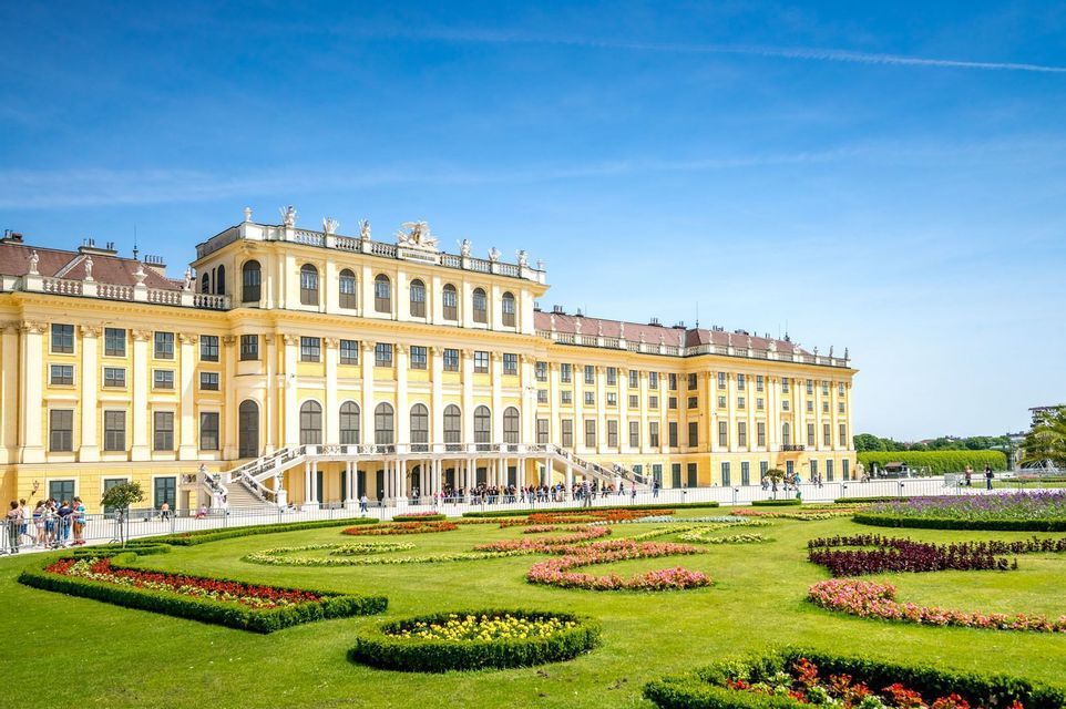Schoenbrunn Palace in Vienna behind its formal flower beds.