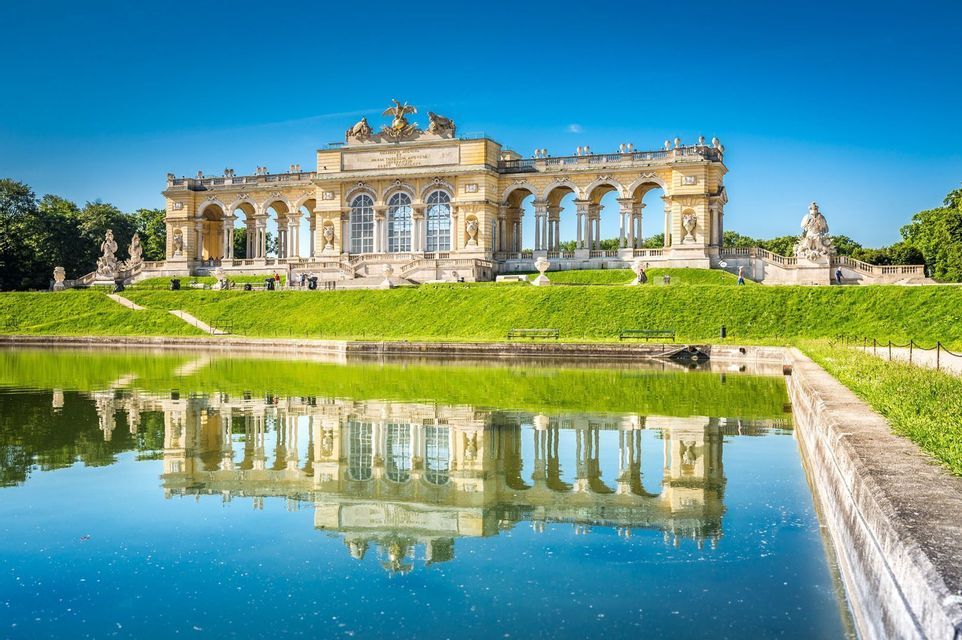 The Gloriette reflected in the pond in the gardens of Schoenbrunn, Vienna.