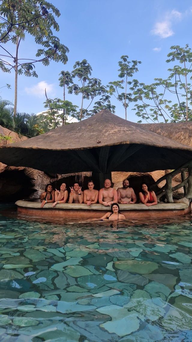 Volcanic hot springs in La Fortuna Travelers relaxing in the volcanic hot spring pools of La Fortuna, Costa Rica