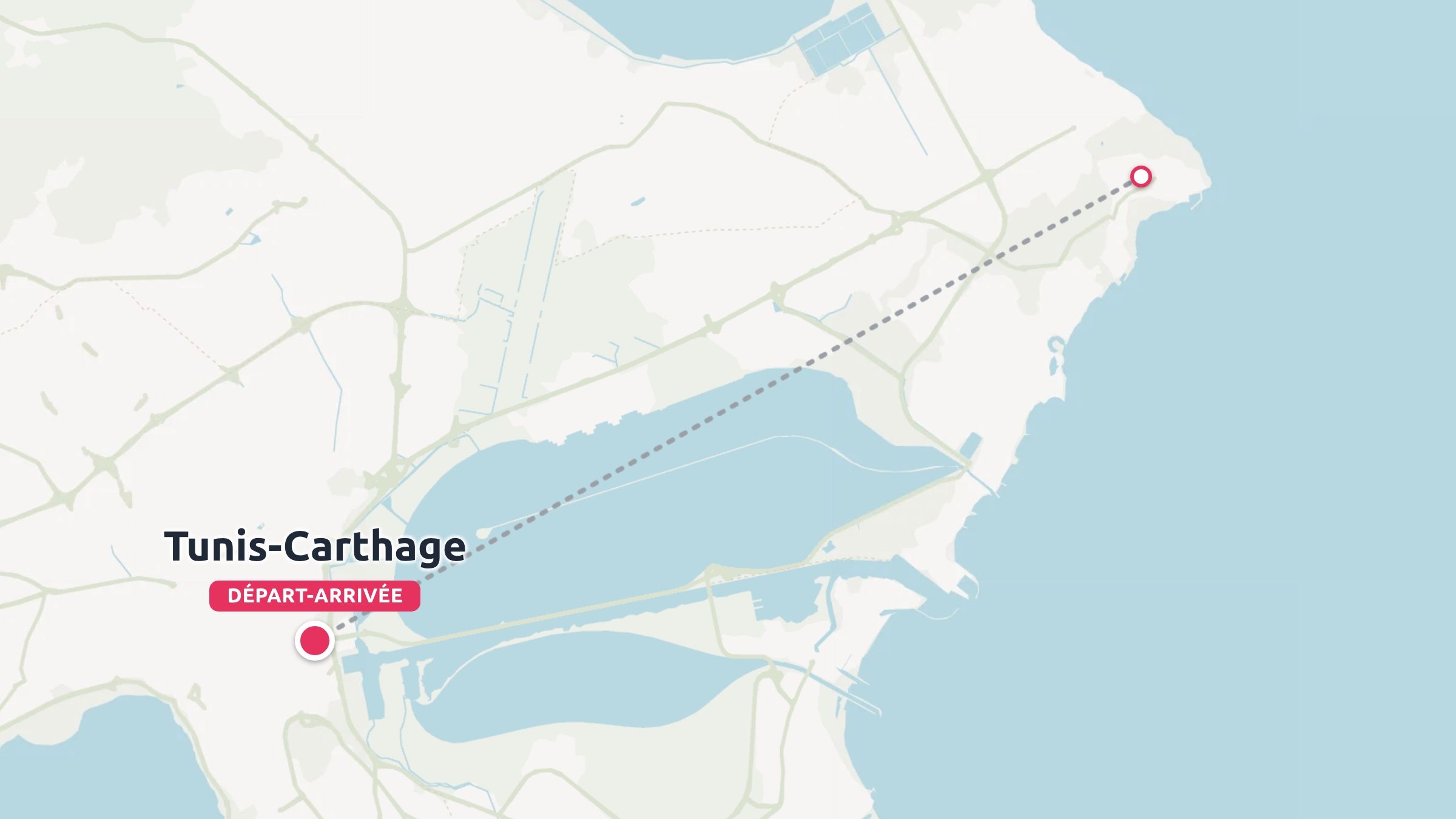 Une carte touristique de Tunis-Carthage indiquant un itinéraire dans la zone côtière entre les points de départ et d'arrivée marqués