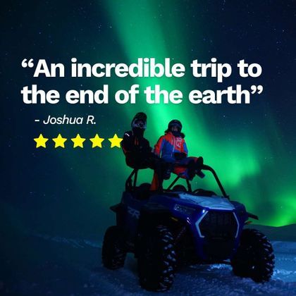 A WeRoad group trip of two people sitting in a blue all-terrain vehicle on a snowy landscape under the aurora borealis.